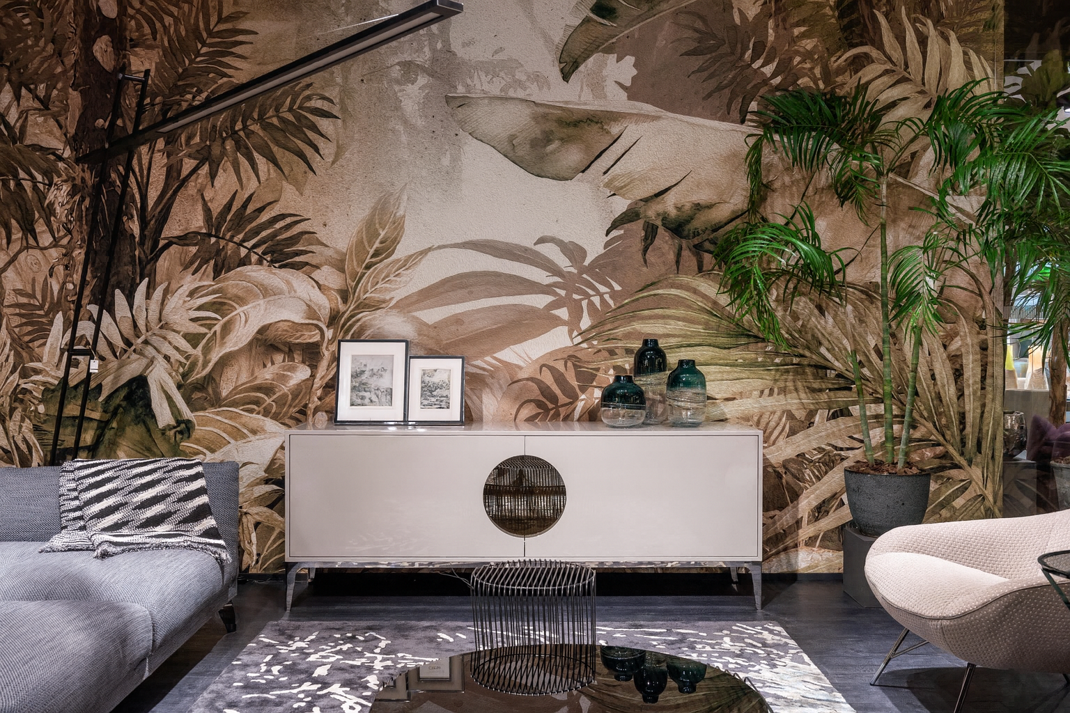Modern living room with decorative wall, console table, and plants