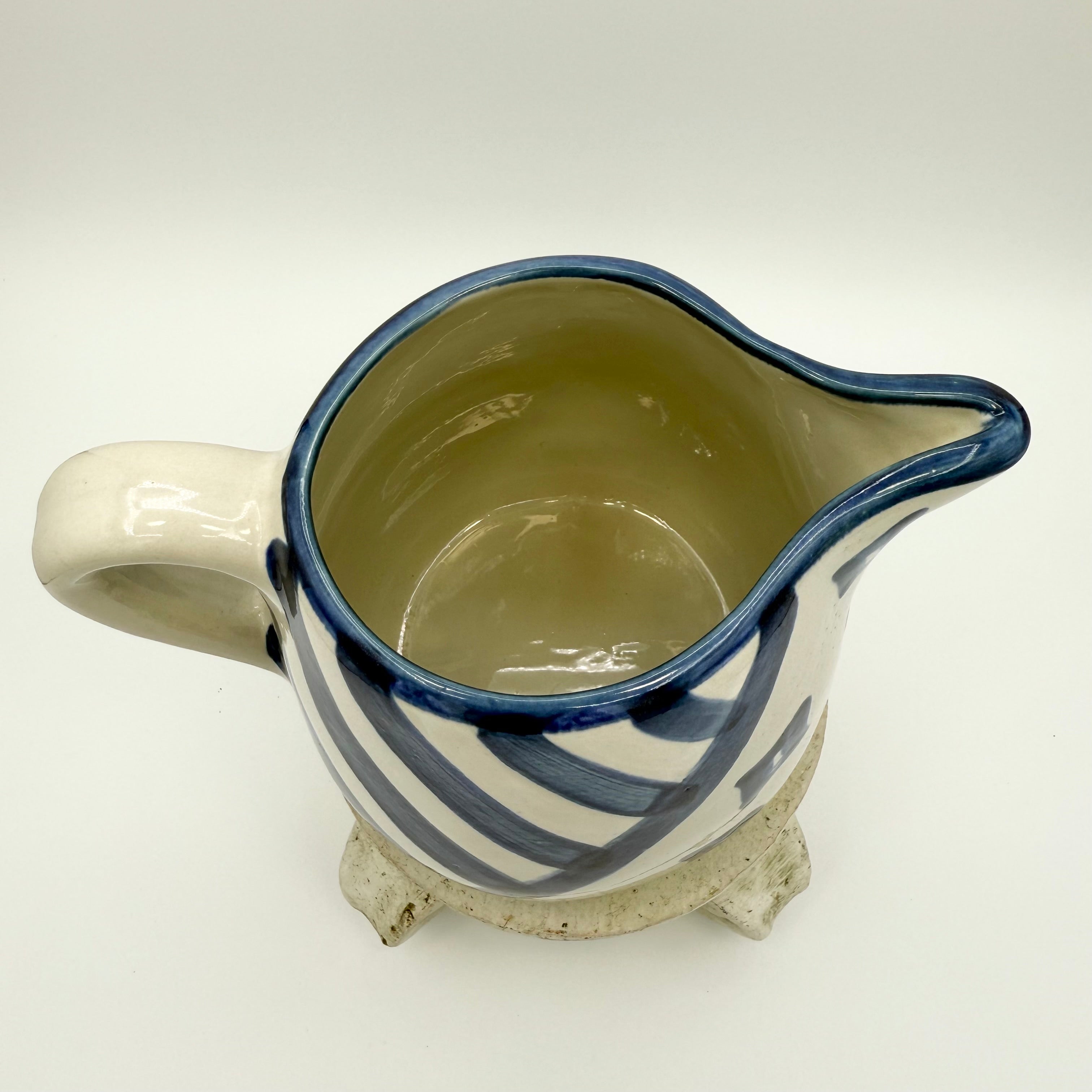 Vintage Louisville Stoneware pitcher with hand-painted blue geometric patterns. Made in Kentucky, USA. Excellent collectible.