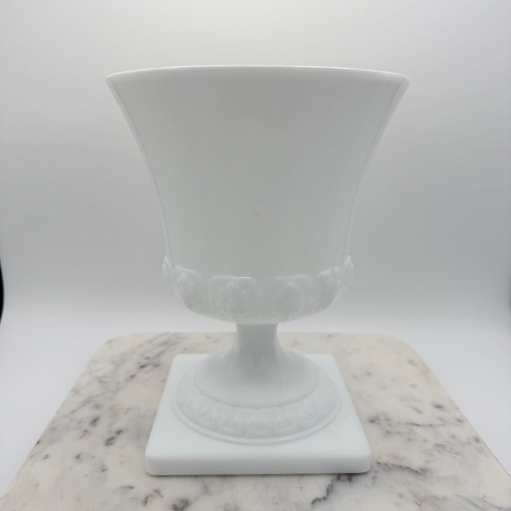 Vintage white milk glass urn with Greek key and leaf motif. Elegant pedestal vase collectible in excellent condition.