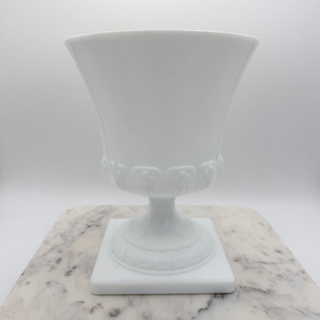 Vintage white milk glass urn with Greek key and leaf motif. Elegant pedestal vase collectible in excellent condition.