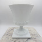Vintage white milk glass urn with Greek key and leaf motif. Elegant pedestal vase collectible in excellent condition.