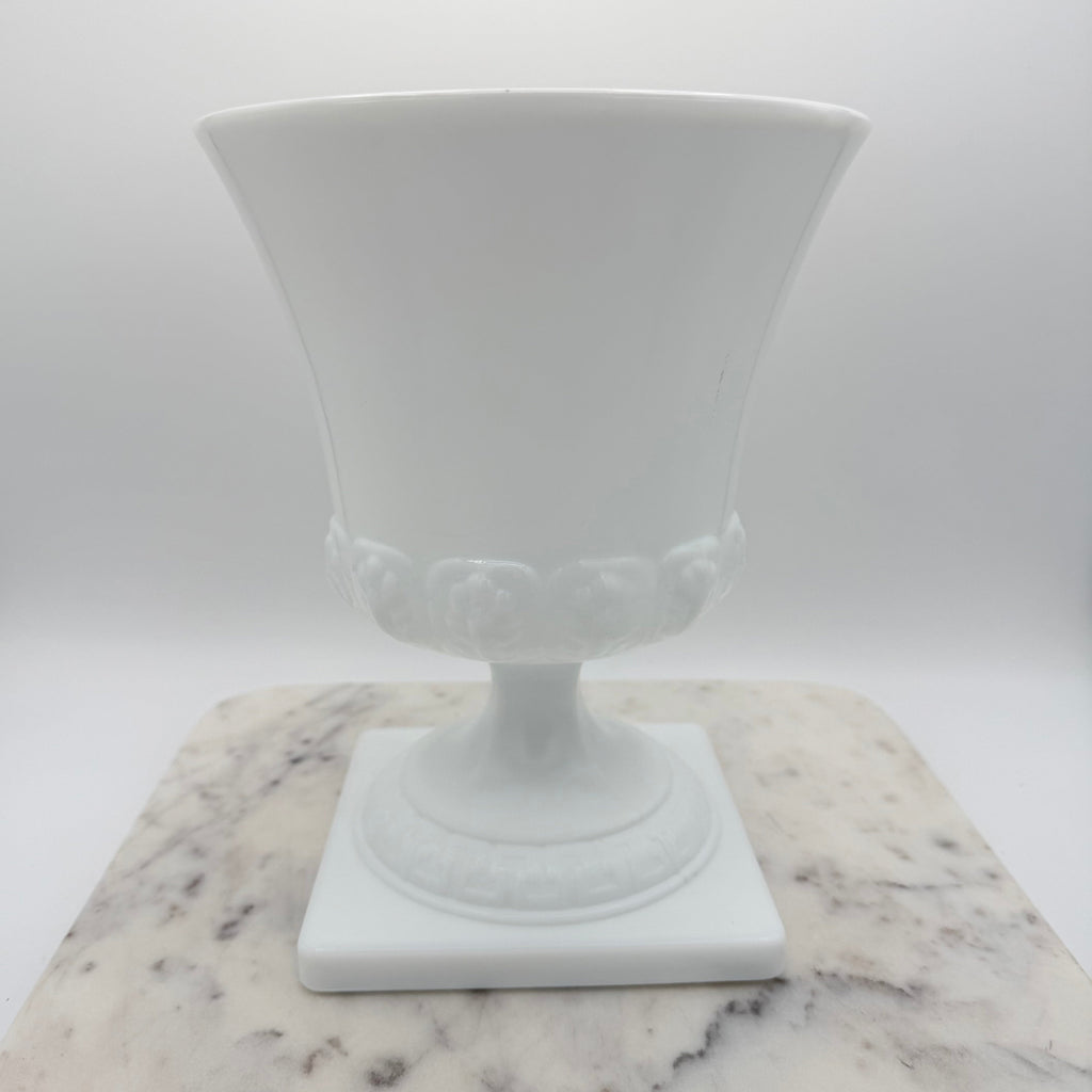 Vintage white milk glass urn with Greek key and leaf motif. Elegant pedestal vase collectible in excellent condition.