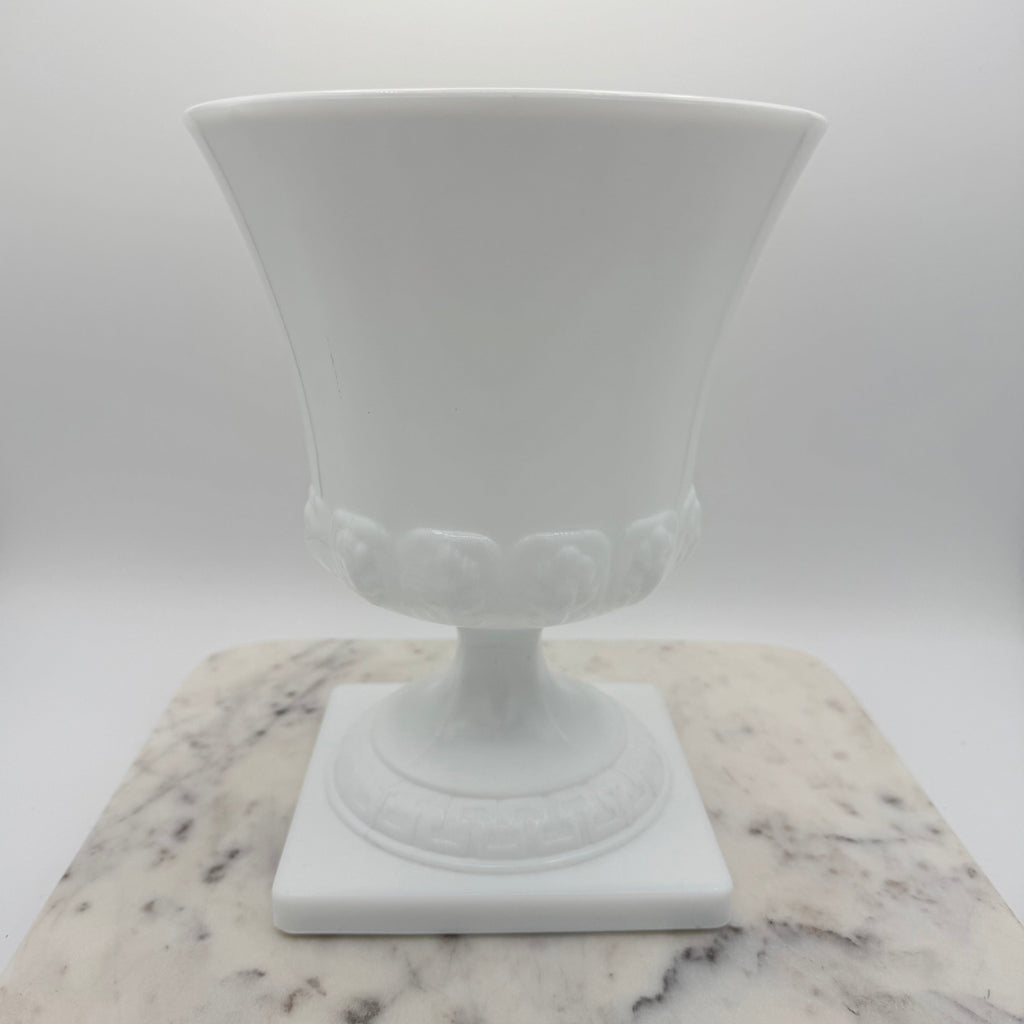 Vintage white milk glass urn with Greek key and leaf motif. Elegant pedestal vase collectible in excellent condition.