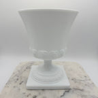 Vintage white milk glass urn with Greek key and leaf motif. Elegant pedestal vase collectible in excellent condition.
