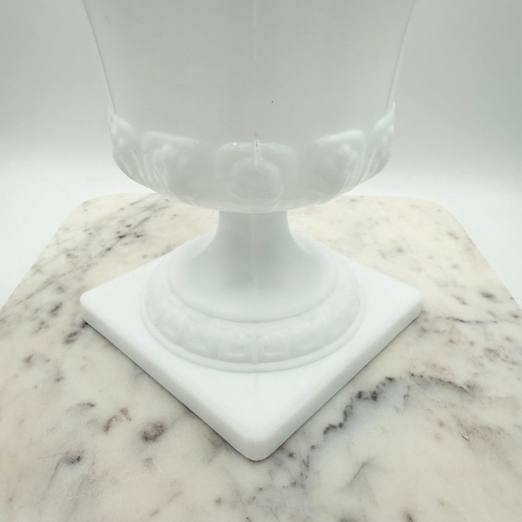 Vintage white milk glass urn with Greek key and leaf motif. Elegant pedestal vase collectible in excellent condition.