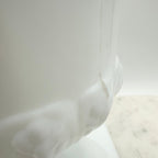 Vintage white milk glass urn with Greek key and leaf motif. Elegant pedestal vase collectible in excellent condition.