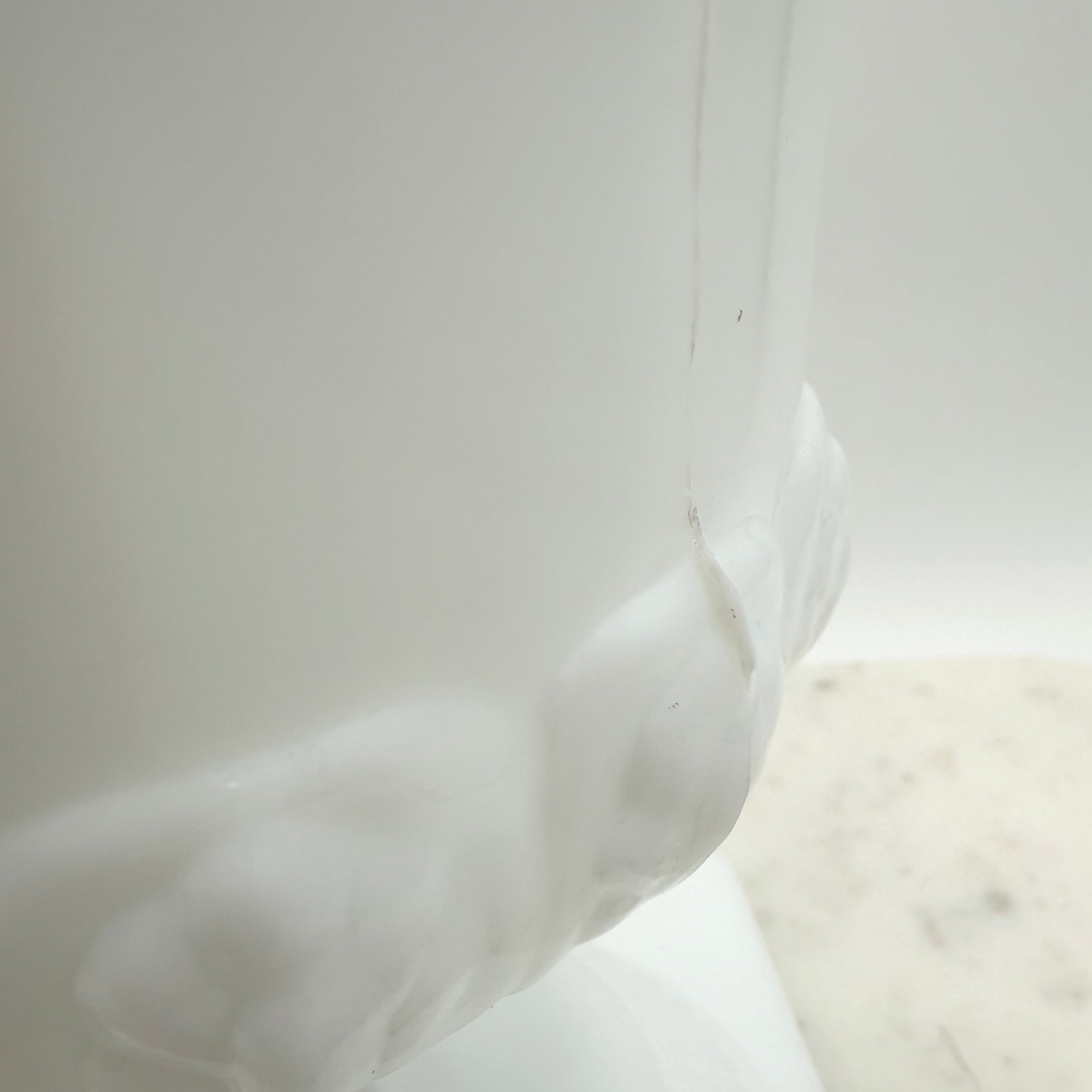 Vintage white milk glass urn with Greek key and leaf motif. Elegant pedestal vase collectible in excellent condition.