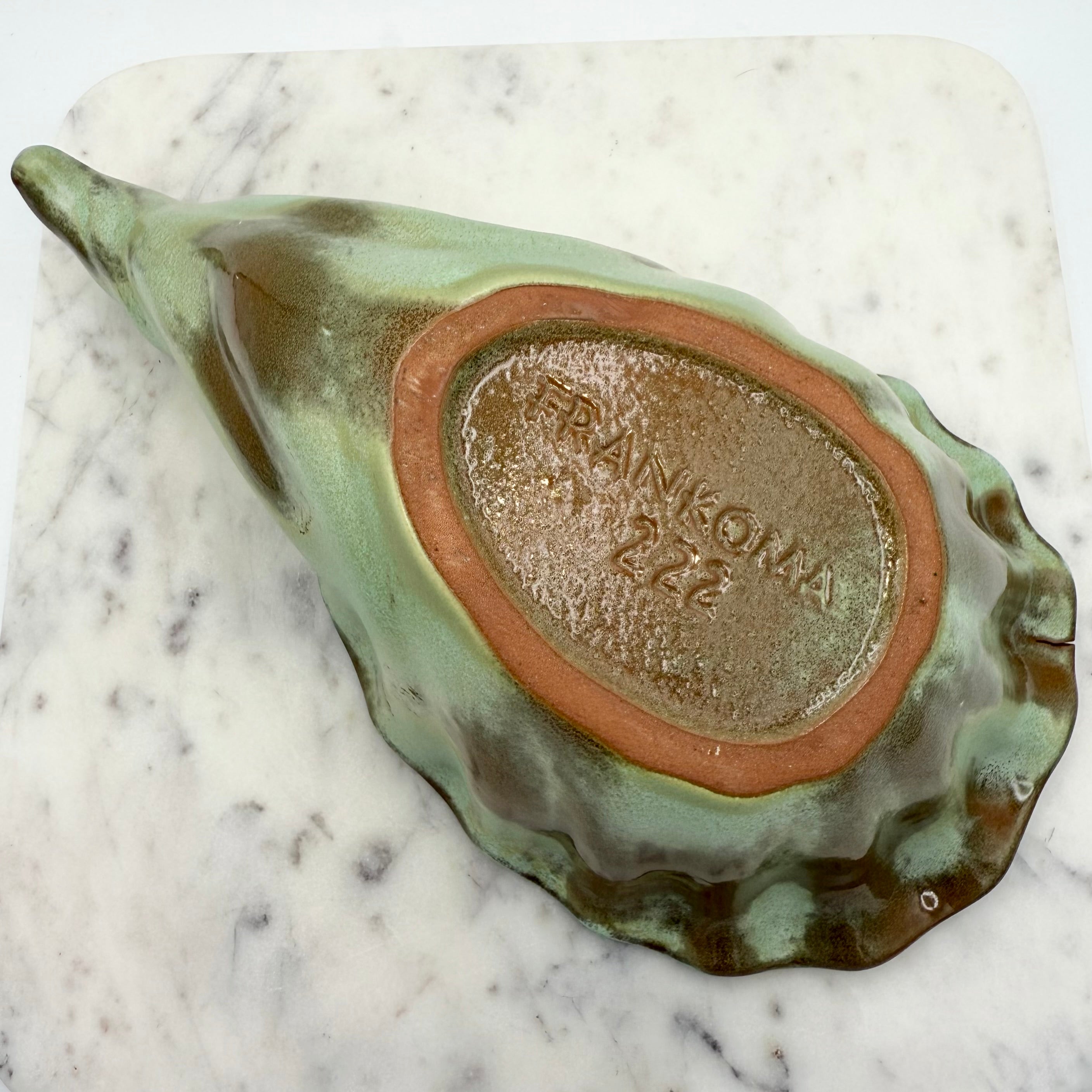 Vintage Frankoma Pottery cornucopia in green and brown glaze. Marked 'Frankoma 222'. Excellent collectible seasonal decor.