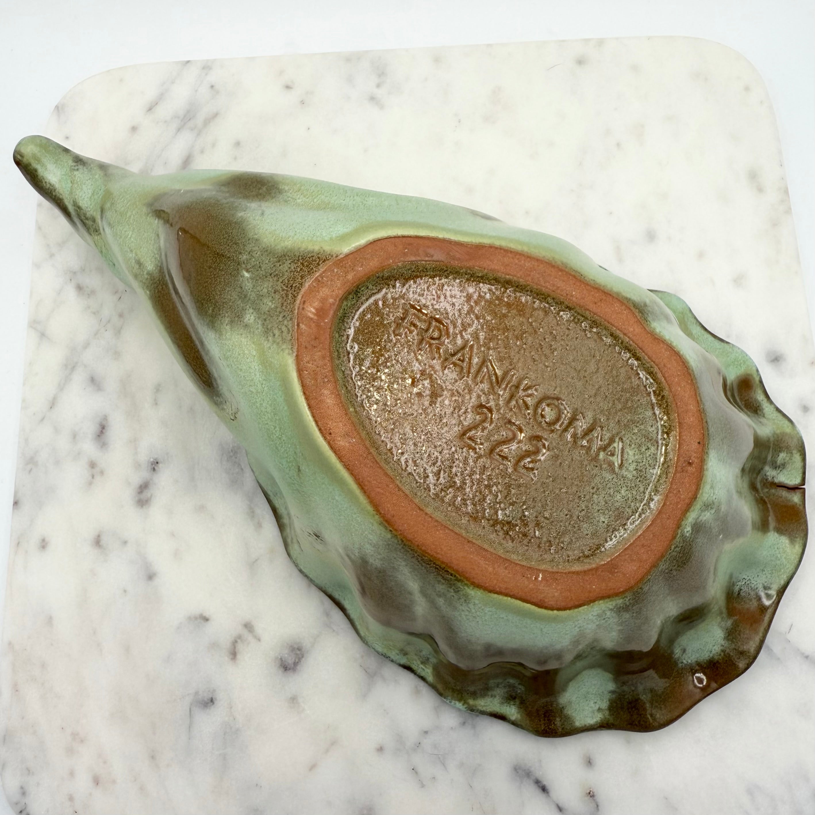 Vintage Frankoma Pottery cornucopia in green and brown glaze. Marked 'Frankoma 222'. Excellent collectible seasonal decor.