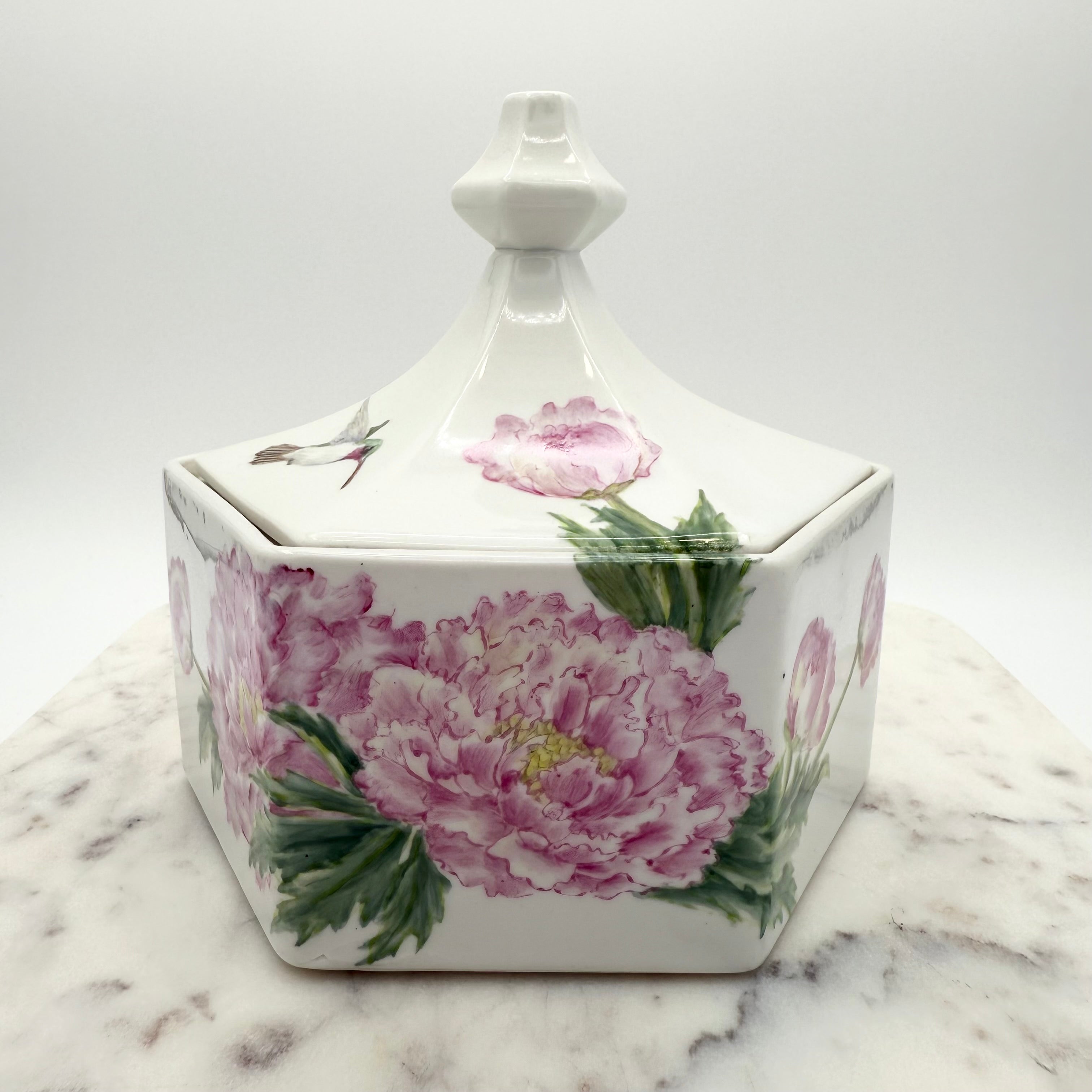 Vintage ceramic lidded box with hand painted peony blossoms. Elegant floral collectible for display or storage.