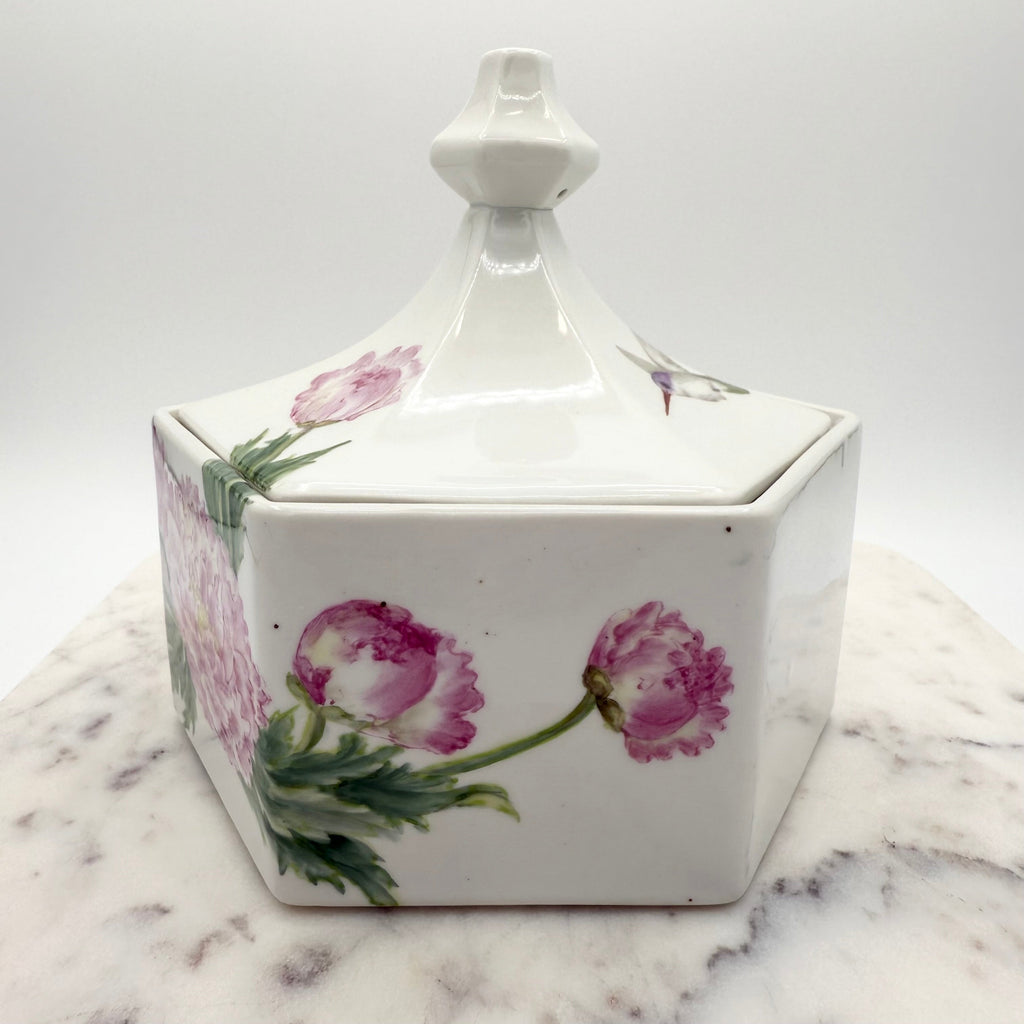 Vintage ceramic lidded box with hand painted peony blossoms. Elegant floral collectible for display or storage.