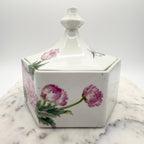 Vintage ceramic lidded box with hand painted peony blossoms. Elegant floral collectible for display or storage.