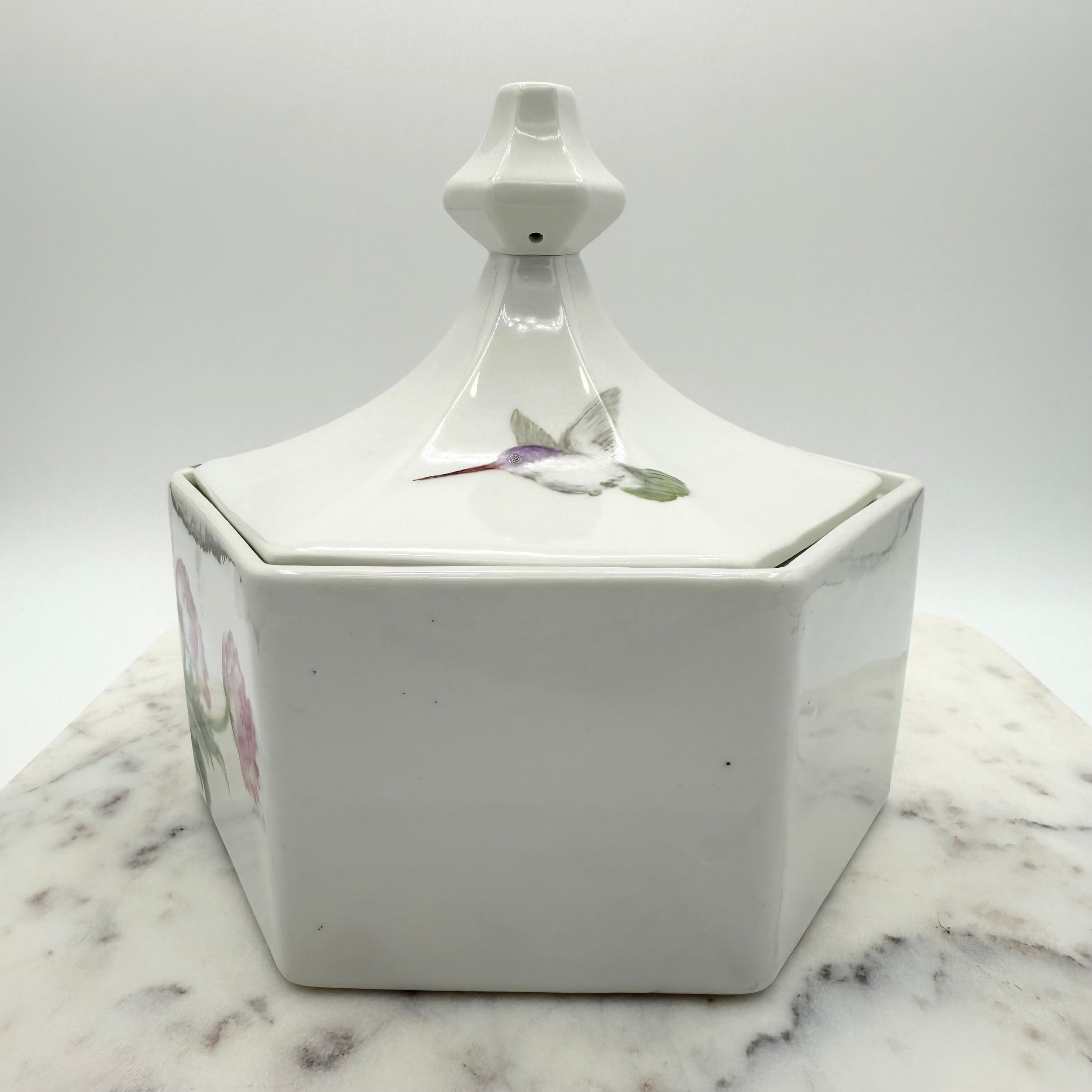 Vintage ceramic lidded box with hand painted peony blossoms. Elegant floral collectible for display or storage.