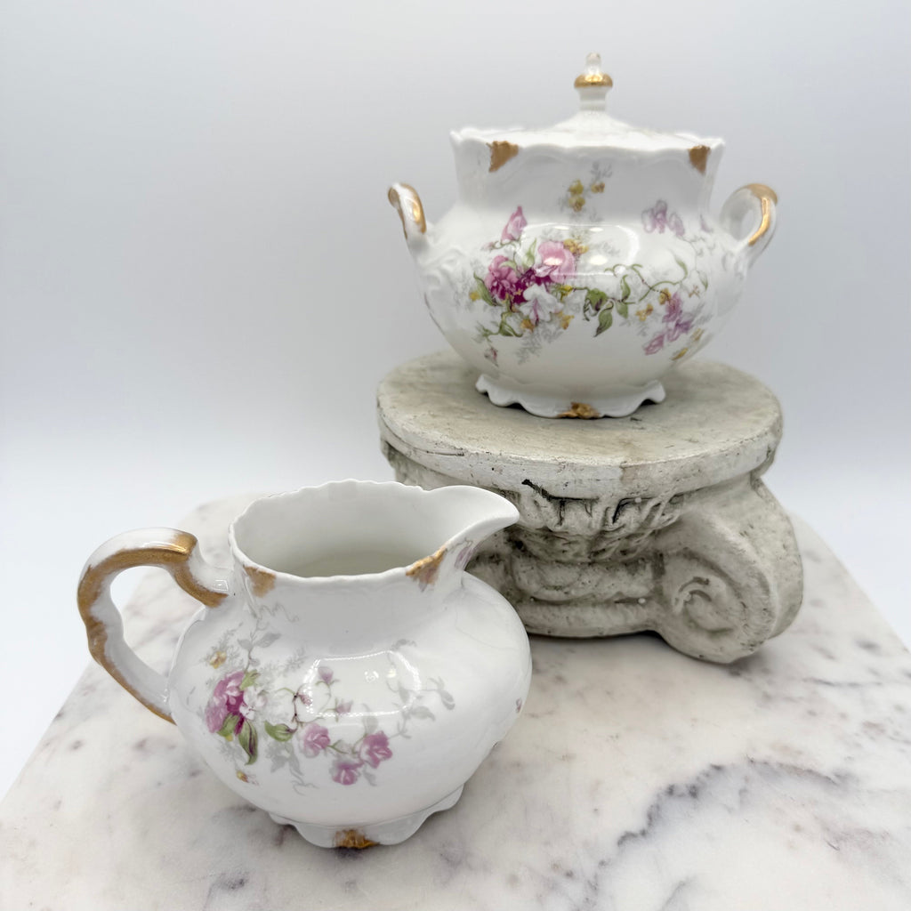 Antique Limoges floral sugar bowl and creamer with gold accents
