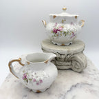 Antique Limoges floral sugar bowl and creamer with gold accents