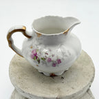 Antique Limoges floral sugar bowl and creamer with gold accents