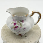 Antique Limoges floral sugar bowl and creamer with gold accents