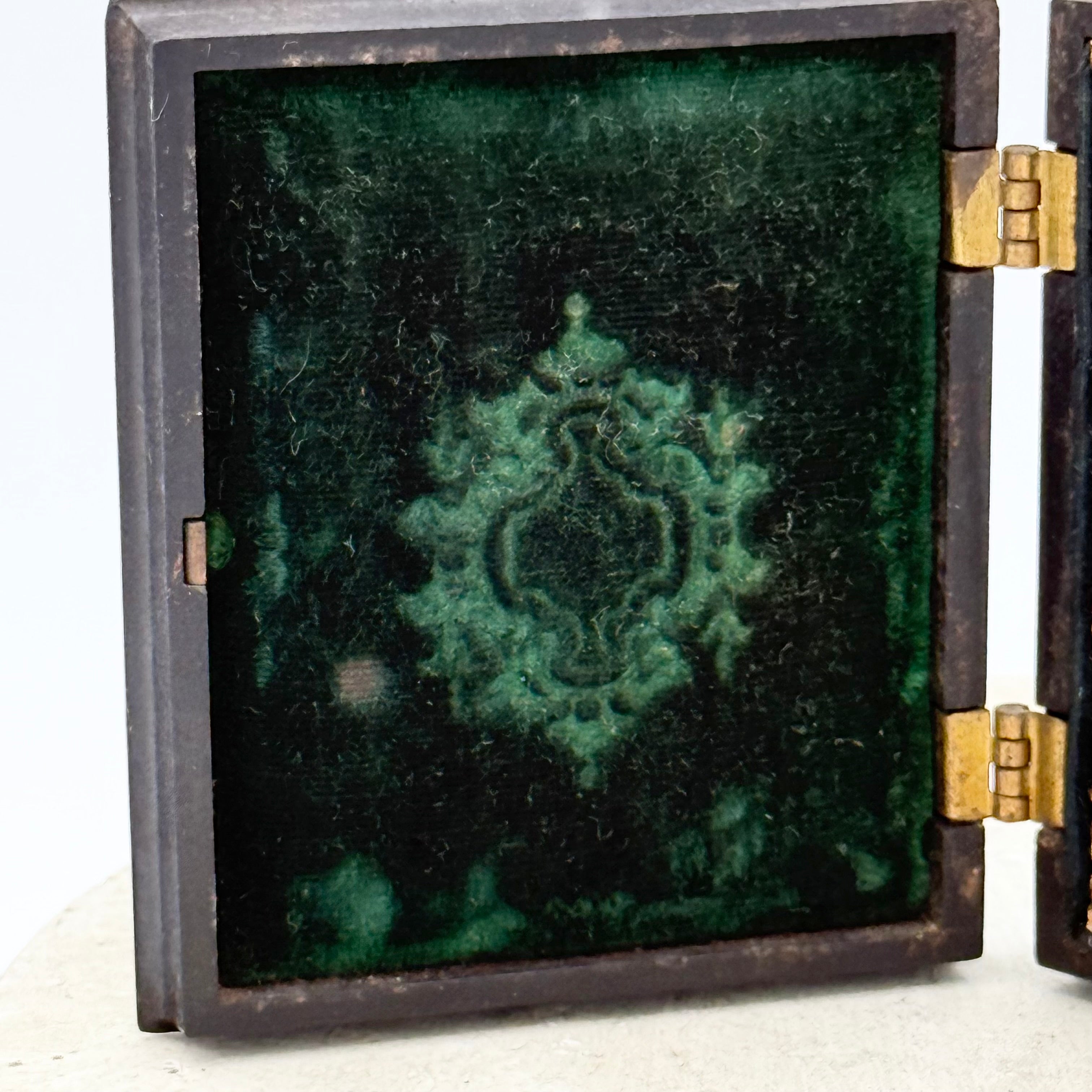 Antique Gutta Percha Frame with Green Velvet Interior and Woman's Photo